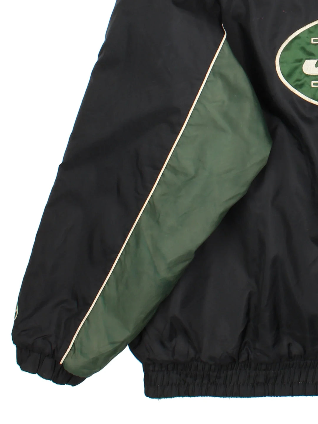 NFL New York Jets Reversible Jacket in a black/green colourway. Zips up with side pockets, elasticated cuffs and hem. Logos embroidered on front and back.