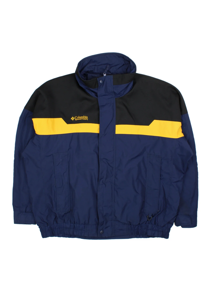 90's Columbia Bugaboo Jacket in a blue colourway with yellow and black panelling. Full button and zip up front with multiple pockets, high collar with small logo on the chest.