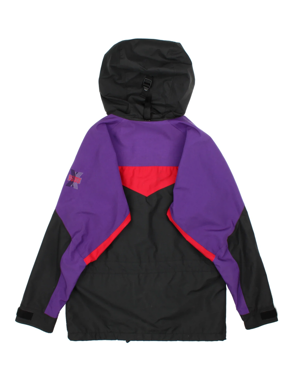 Berghaus Trango Extrem 7000 Jacket in a black colourway with purple and red panelling. Full button and zip up front with multiple pockets, drawstring hood and small logo on the front.