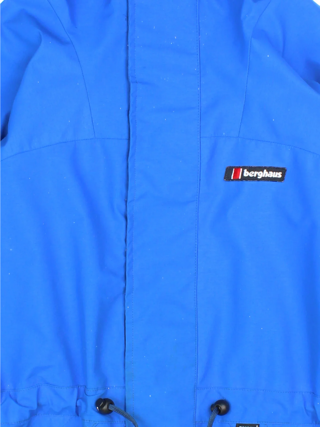 Berghaus Lightning Gore-Tex Jacket in a blue colourway. Full button and zip up front with multiple pockets, drawstring hood and small logo on the front.