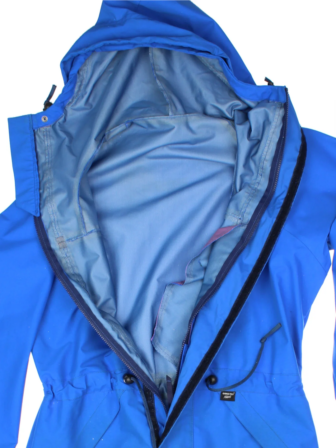Berghaus Lightning Gore-Tex Jacket in a blue colourway. Full button and zip up front with multiple pockets, drawstring hood and small logo on the front.