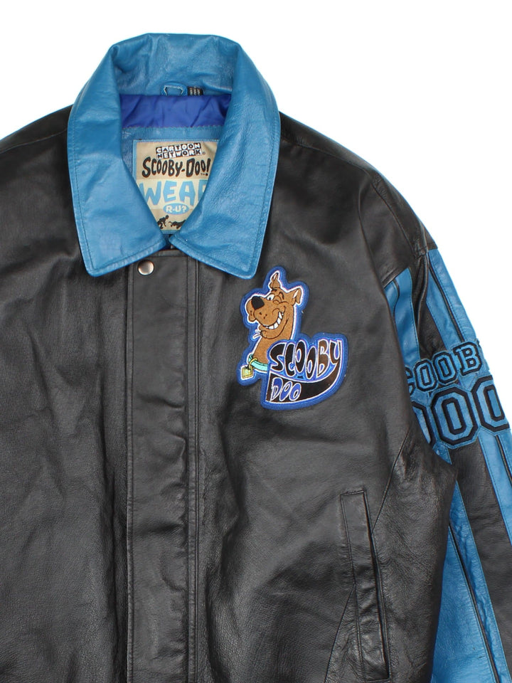 Vintage Scooby-Do Wear R U? Leather Varsity Jacket in a black and blue colourway. Zips up and has side pockets, and the spell out and character graphic embroidered on the front and back.