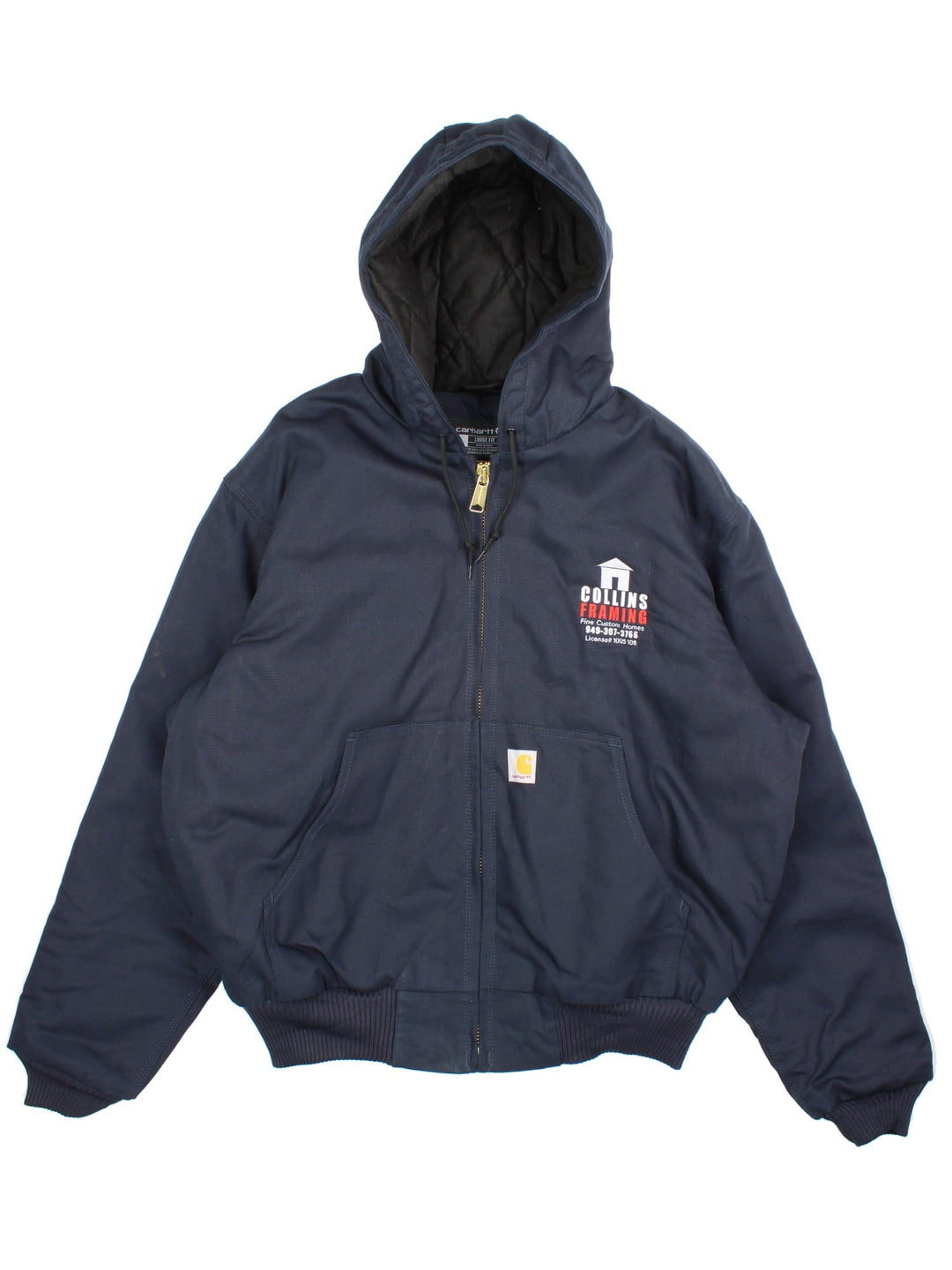 Carhartt Active Jacket in a navy blue colourway. Zips up and has side pockets, insulated with a quilted lining, hooded, and has the Carhartt amd 'Colins Framing' company logo embroidered on the front.