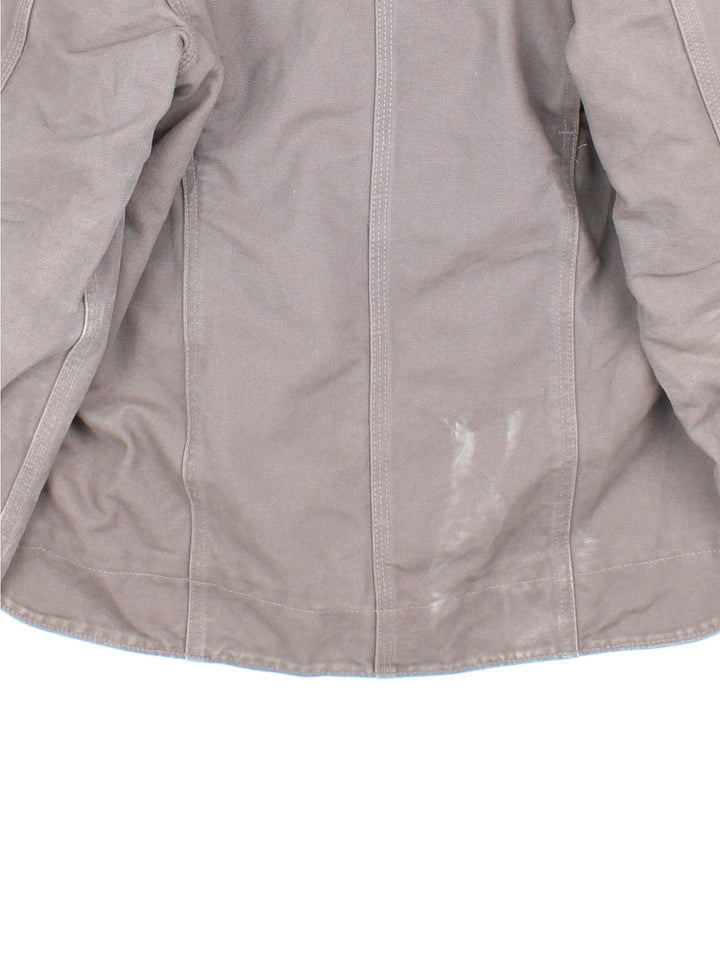 Carhartt Jacket in a grey colourway. Zips up and has multiple pockets, insulated with a sherpa lining, and has the logo and 'Goodfellow' logo embroidered on the front.