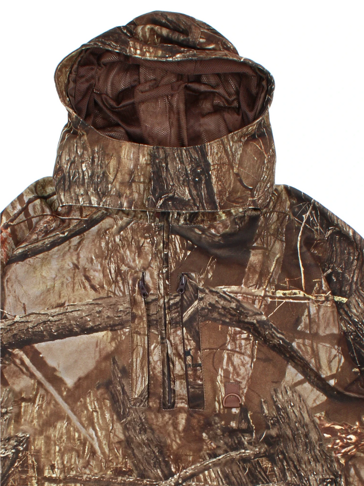 Real Tree 1/4 Zip Jacket in a green colourway. Zips up and has multiple pockets, insulated with a mesh lining, and all over pattern.