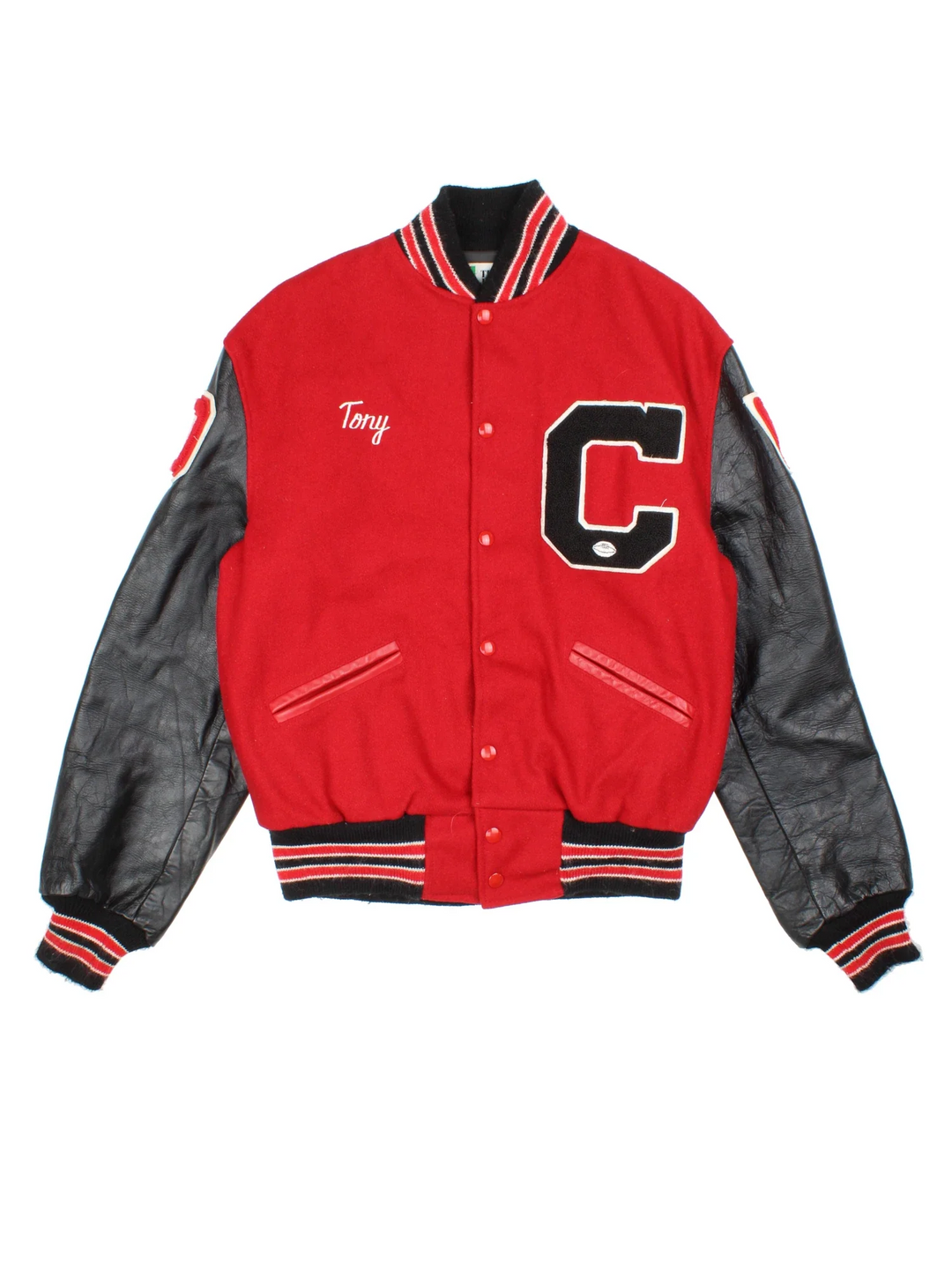 Vintage 80's Varsity Jacket in a red/black colourway. Buttons up, with contrast leather sleeves, elasticated hems/cuffs with embroidered detailing.