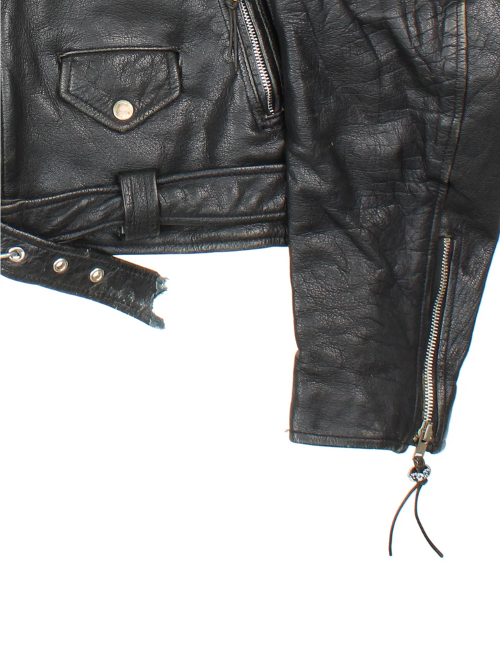 Vintage Beaded Leather Biker Jacket in a black colourway. Zip fastening, multiple pockets, motorcycle detailing and beaded detail on zippers.