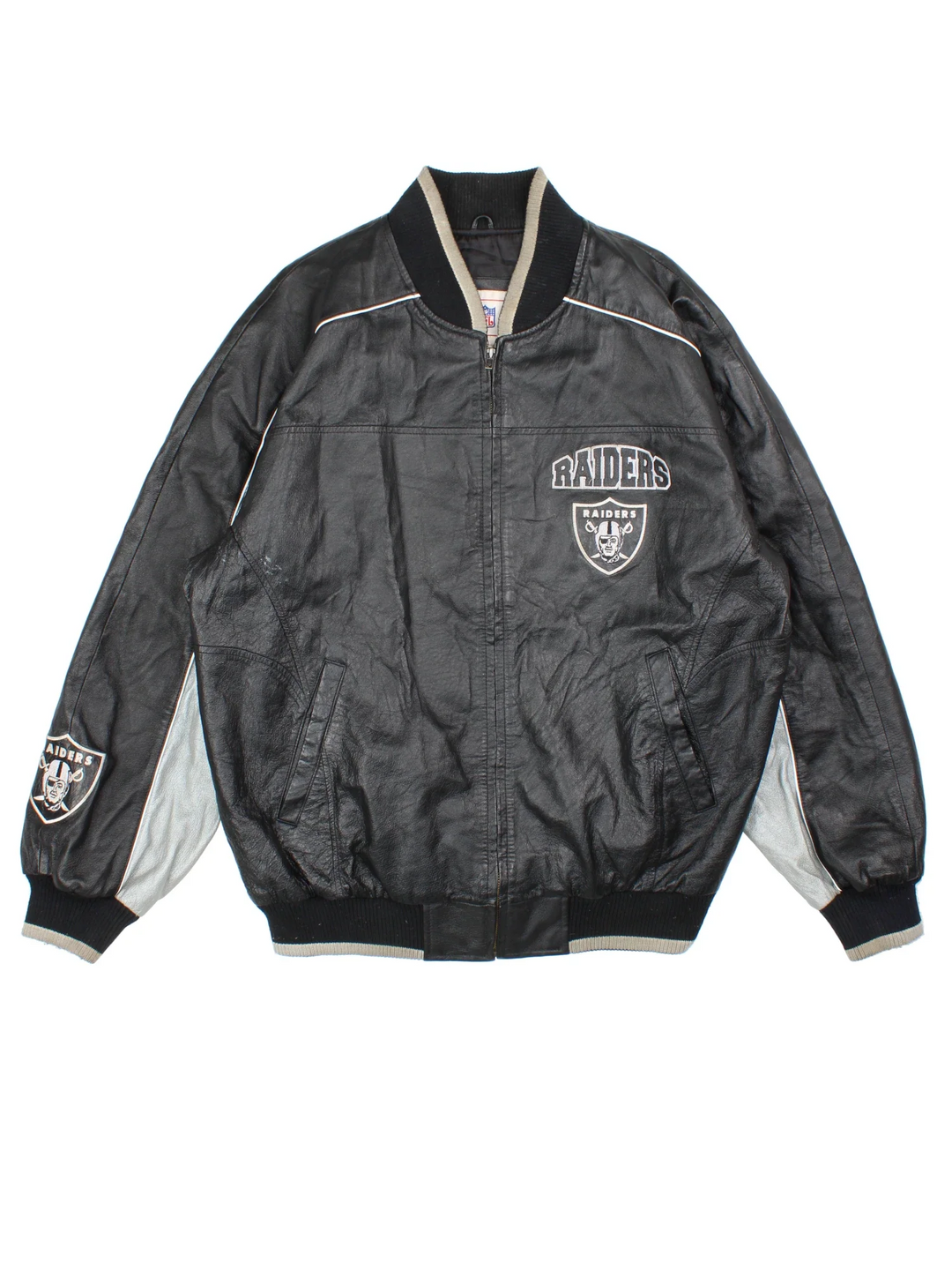90's NFL Oakland Raiders Leather Bomber Jacket in a black/grey colourway. Zip fastening, side pockets, satin lining and embroidered branding on front/back.