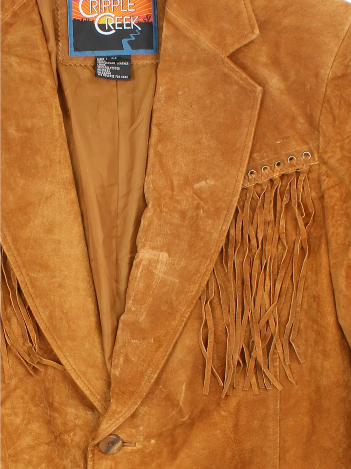 Vintage Western Fringed Leather Jacket in a tan colourway. Button fastening, with front pockets and fringe detail.