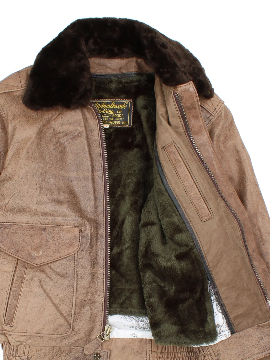 Vintage 80's Leather Flight Jacket in a brown colourway. Zip fastening, with front pockets and fur lining/collar.