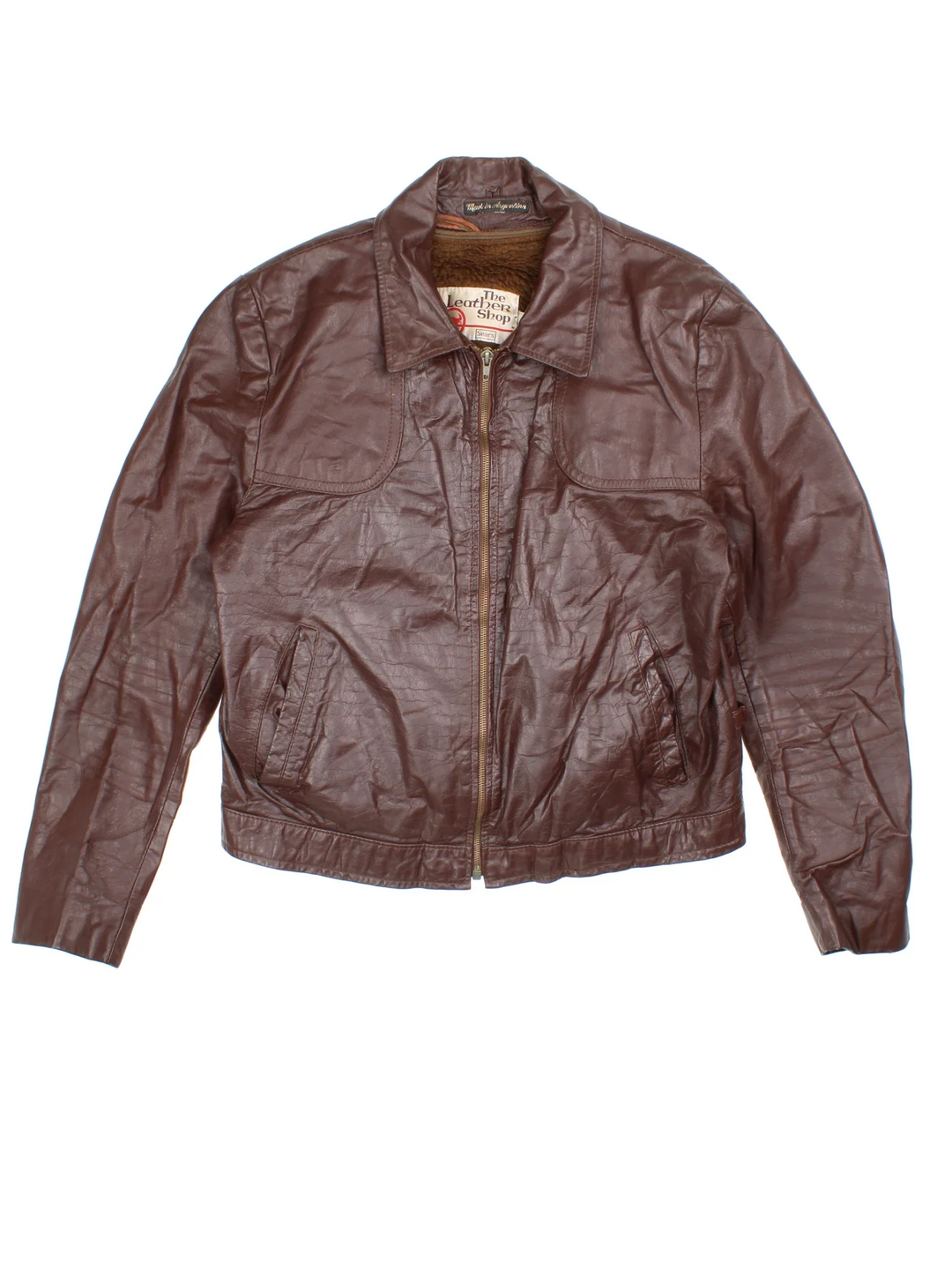 Vintage 70's Leather Bomber Jacket in a brown colourway. Zip fastening, with side pockets and detatchable fur lining.