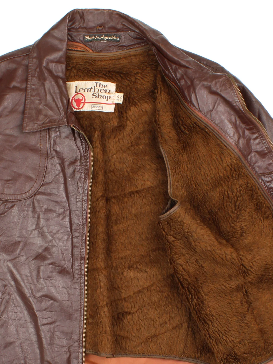 Vintage 70's Leather Bomber Jacket in a brown colourway. Zip fastening, with side pockets and detatchable fur lining.