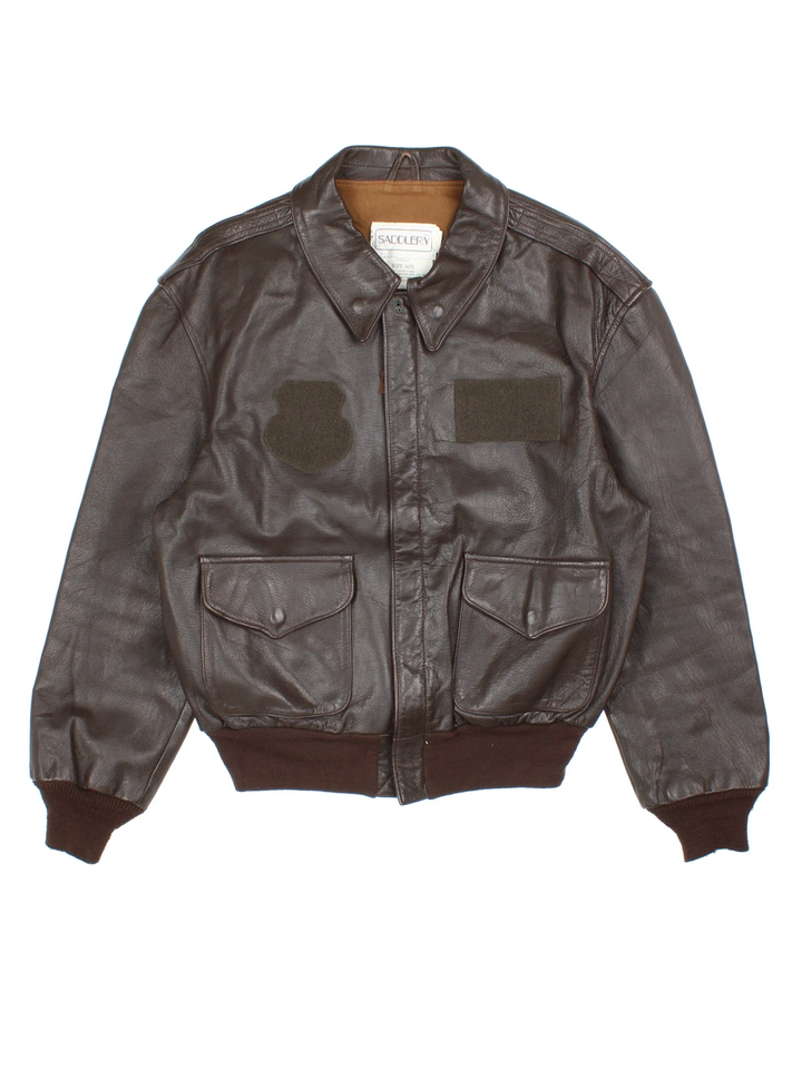 Vintage 80's Cooper Saddlery A2 Flight Jacket in a brown colourway. Zip fastening, with multiple pockets, elasticated trims and cotton lining.