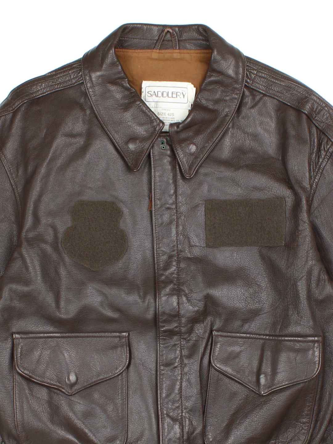 Vintage 80's Cooper Saddlery A2 Flight Jacket in a brown colourway. Zip fastening, with multiple pockets, elasticated trims and cotton lining.