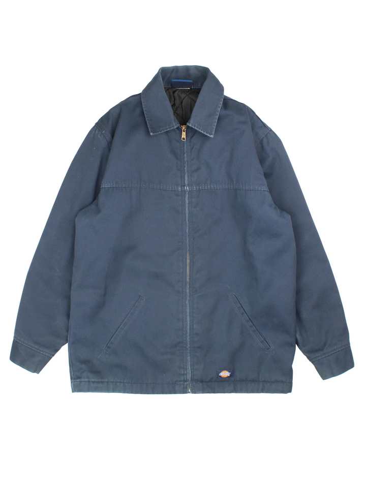 Vintage Dickies Eisenhower Jacket in a blue colourway. Zips up and has side pockets, insulated with a quilted lining, and has the logos embroidered on the front.