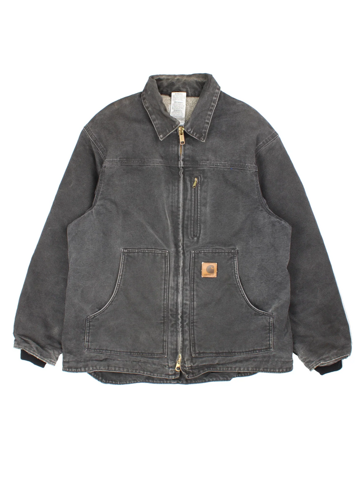 Vintage Carhartt Arctic Jacket in a black colourway. Zips up and has side pockets, insulated with a fleece lining, and has leather logo on the front.