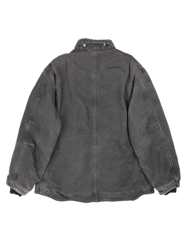 Vintage Carhartt Arctic Jacket in a black colourway. Zips up and has side pockets, insulated with a fleece lining, and has leather logo on the front.