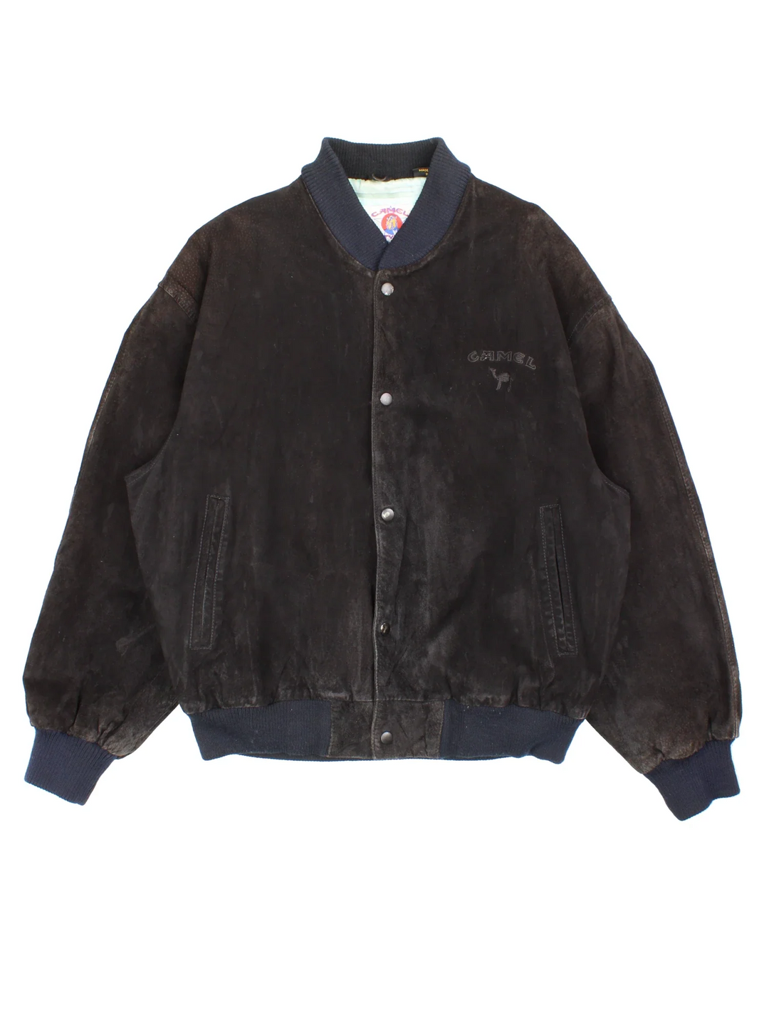 Vintage 90's Camel Suede Bomber Jacket in a black colourway. Buttons up and has side pockets, insulated with a satin lining, and has the logo embroidered on the front.
