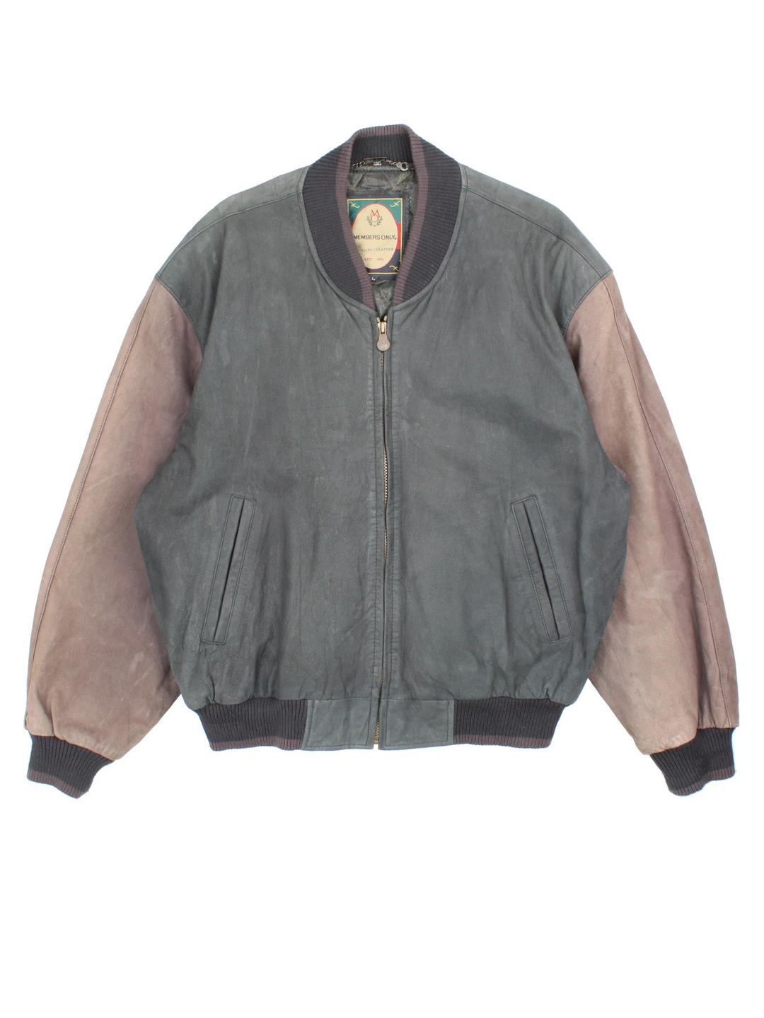 Vintage 90's Members Only Leather Bomber Jacket in a brown colourway. Zips up and has side pockets, insulated with a quilted lining, and has elasticated cuffs and hems.
