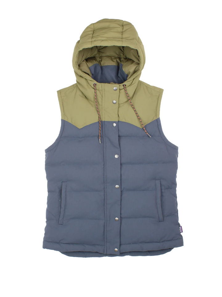 Patagonia Bivy Hooded Gilet in a blue and green colourway. Zip and button up closure, has side pockets, insulated lining, and has the logo tab embroidered on the left side.
