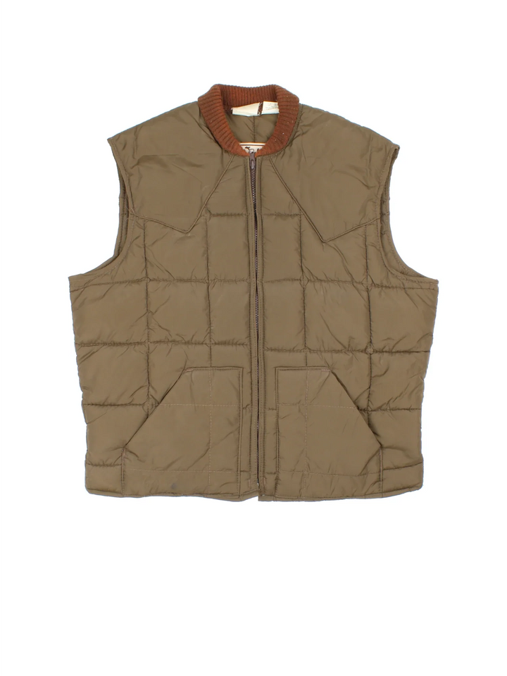 Vintage 80's Walls Puffer Gilet in a brown colourway. Zips up and has side pockets, insulated lining and has contrast stitching.