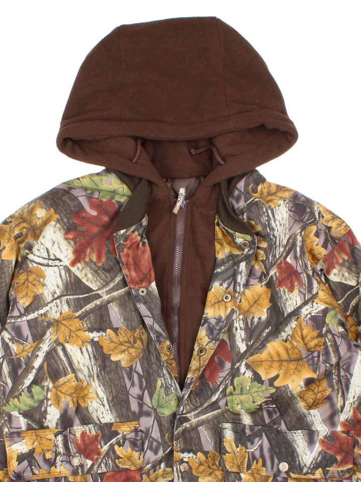 Vintage Real Tree Camo Hooded Jacket in a brown colourway. Zip and button up closure, has multiple pockets, insulated with a quilted lining, and hooded.