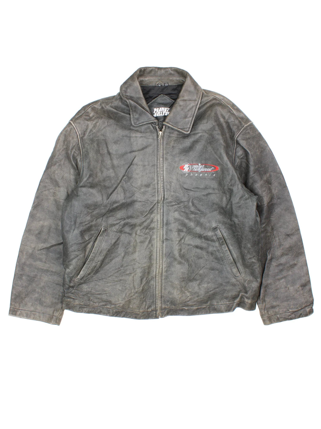 Vintage 90's Planet Hollywood Leather Jacket in a grey colourway. Zips up and has side pockets, insulated with a quilted lining, and has the logo embroidered on the front.
