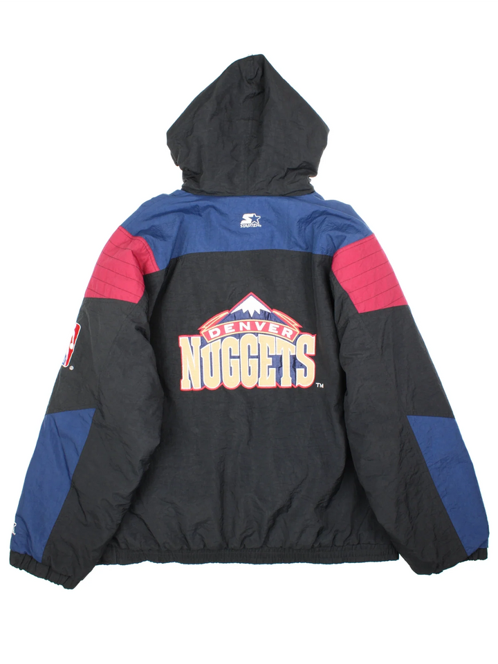 90's Denver Nuggets NBA Starter Jacket in a black colourway with blue and red panelling. Half zip up closure, has multiple pockets, insulated lining, and has the team logo embroidered on the front and back.