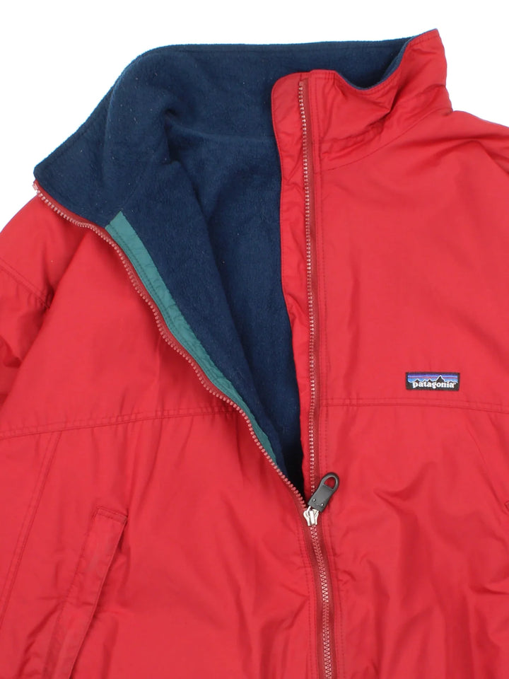 Vintage Patagonia Jacket in a red colourway. full zip up and has side pockets, fleece lining and small classic logo on the front.