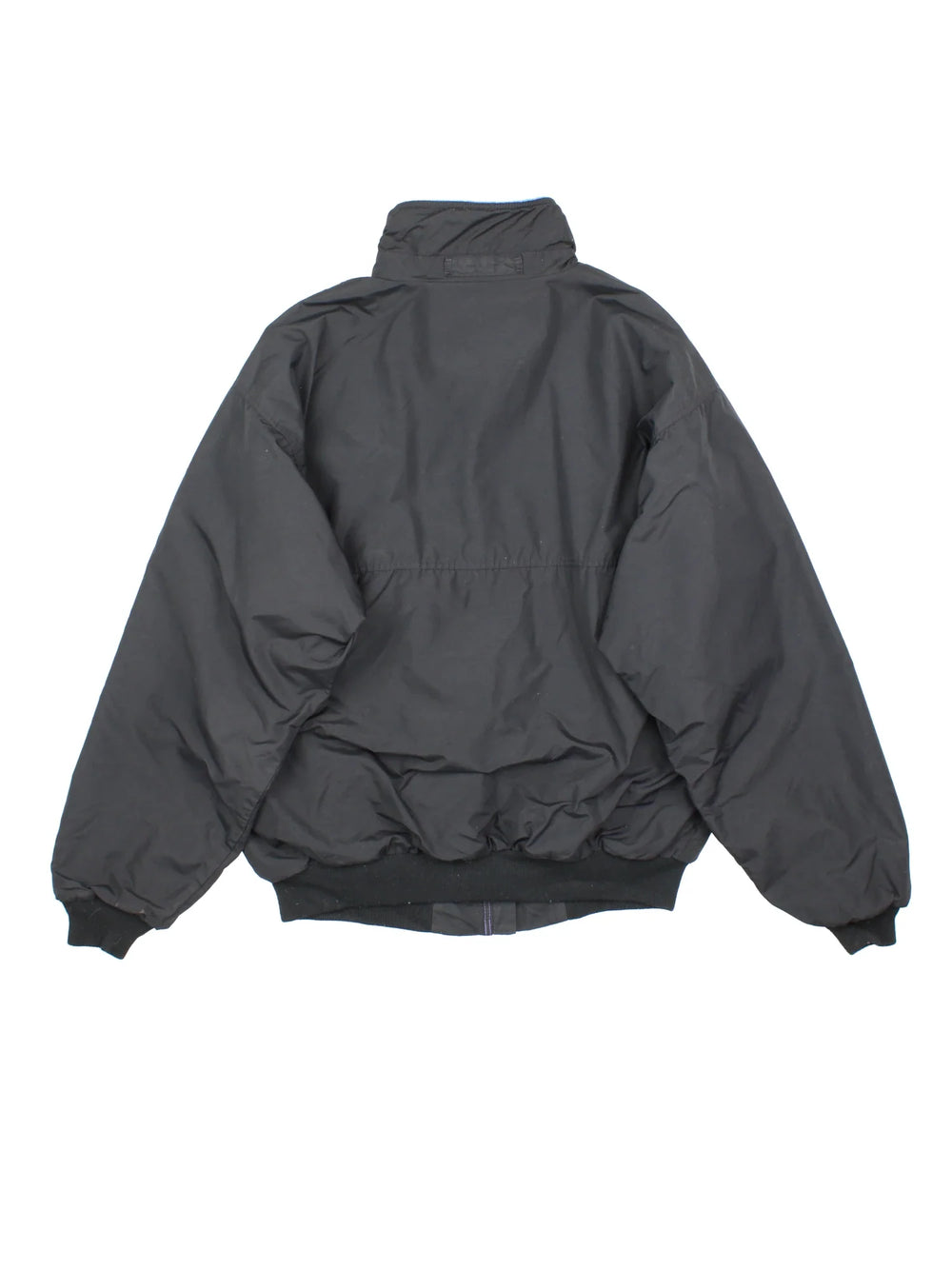 Vintage Patagonia Fleece Lined Jacket in a black colourway with blue fleece lining. Full zip up and has side pockets and small classic logo on the front.