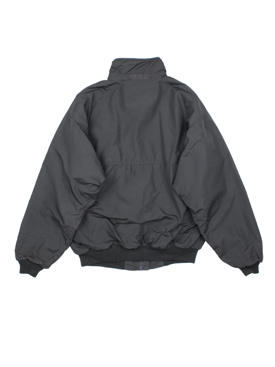 Vintage Patagonia Fleece Lined Jacket in a black colourway with blue fleece lining. Full zip up and has side pockets and small classic logo on the front.