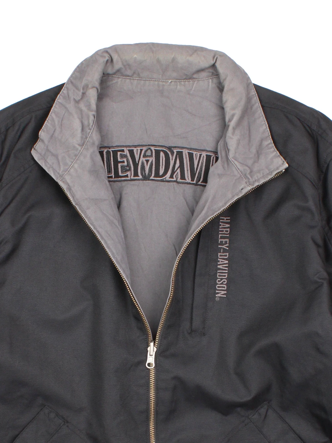 Harley-Davidson Jacket in a black colourway with grey revesible side. Full zip up, multiple pockets and large graphic on the back and brand logo.