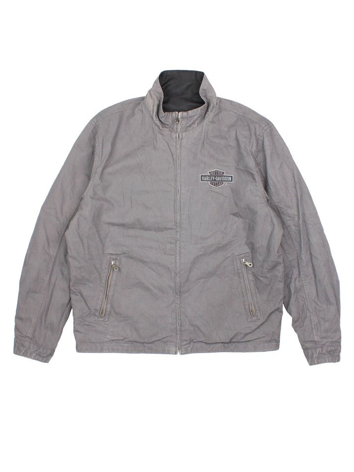 Harley-Davidson Jacket in a black colourway with grey revesible side. Full zip up, multiple pockets and large graphic on the back and brand logo.