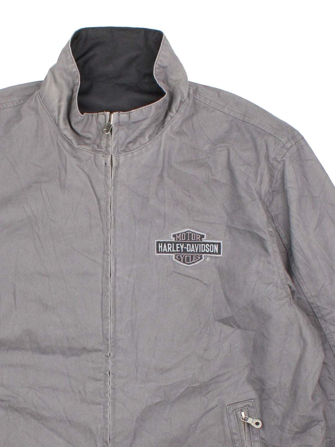 Harley-Davidson Jacket in a black colourway with grey revesible side. Full zip up, multiple pockets and large graphic on the back and brand logo.