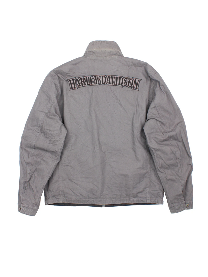 Harley-Davidson Jacket in a black colourway with grey revesible side. Full zip up, multiple pockets and large graphic on the back and brand logo.
