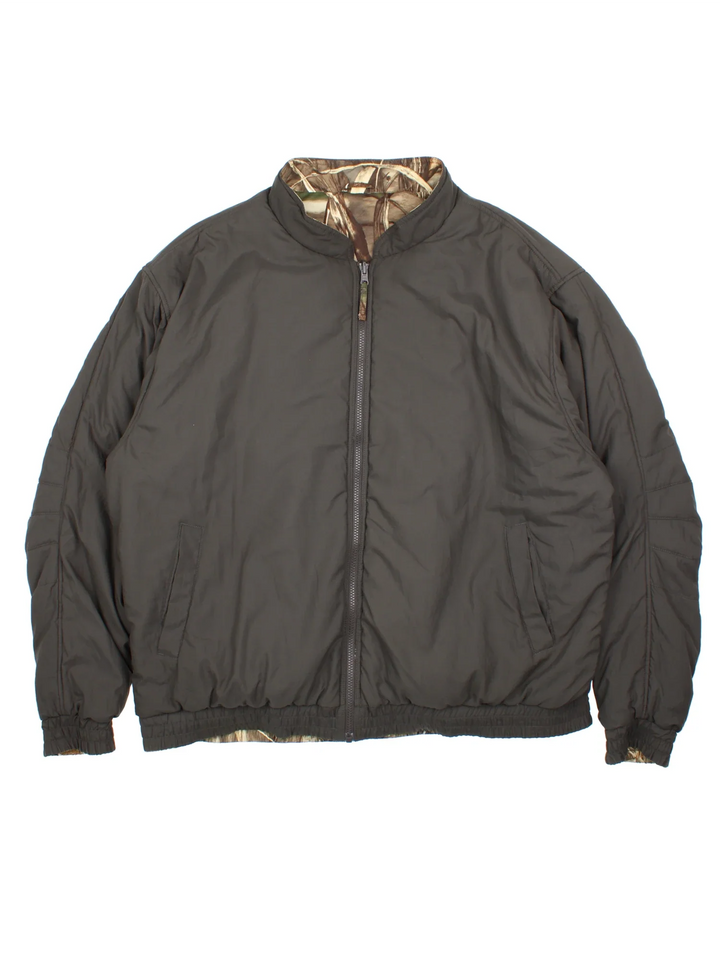 Vintage Real Tree Camo Reversible Bomber Jacket in a brown colourway with dark grey revesible side. Full zip up, multiple pockets and all over camo print on one side.