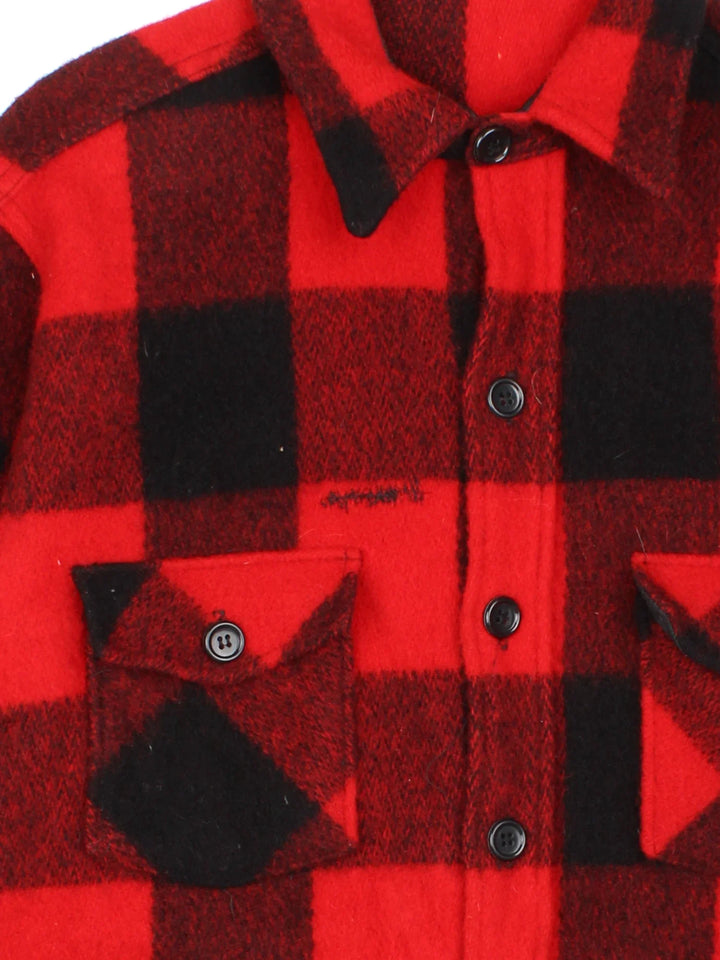Woolrich CPO Jacket in a red and black colourway with full button up and multiple pockets. All over plaid patterning.