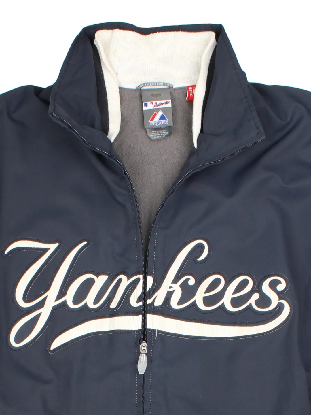 MLB New York Yankees Light Jacket in a blue colourway with full zip up and large text logo across the front. Fleece lining inside and around the collar. Small MLB logo on the back neck.