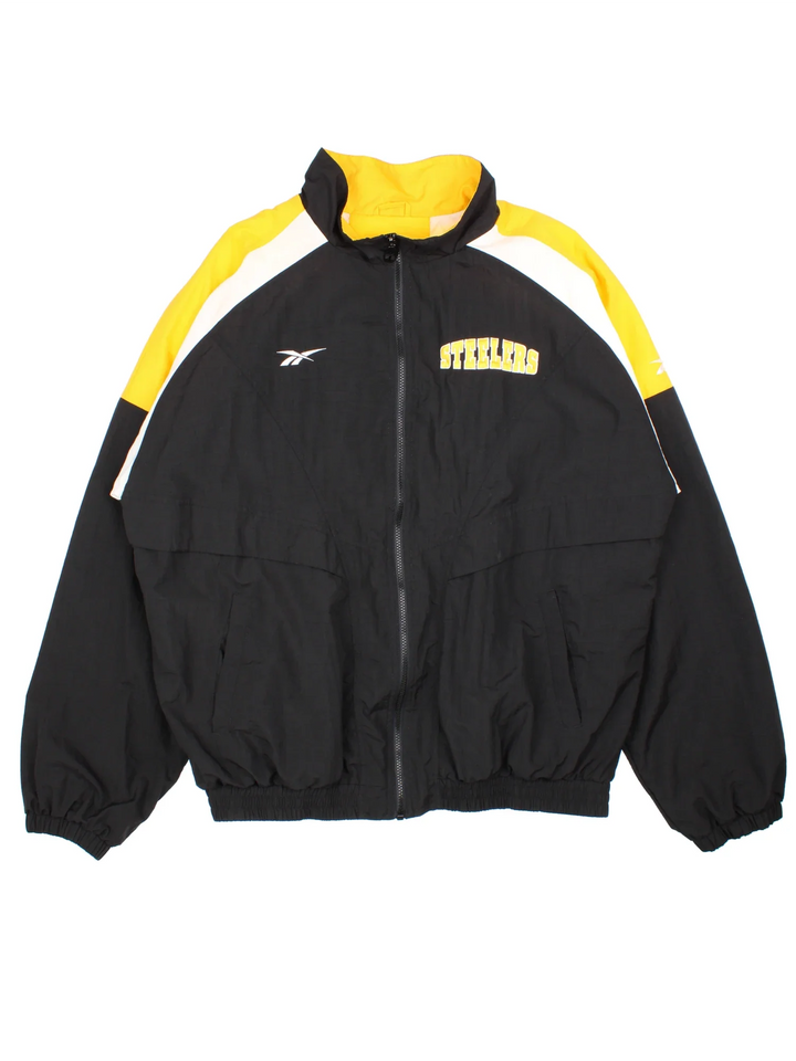 Reebok Pittsburgh Steelers NFL Track Jacket in a black colourway with yellow and white detailing on the sholuders and arms, full zip up with small classic logo on the front and large team logo on the back.