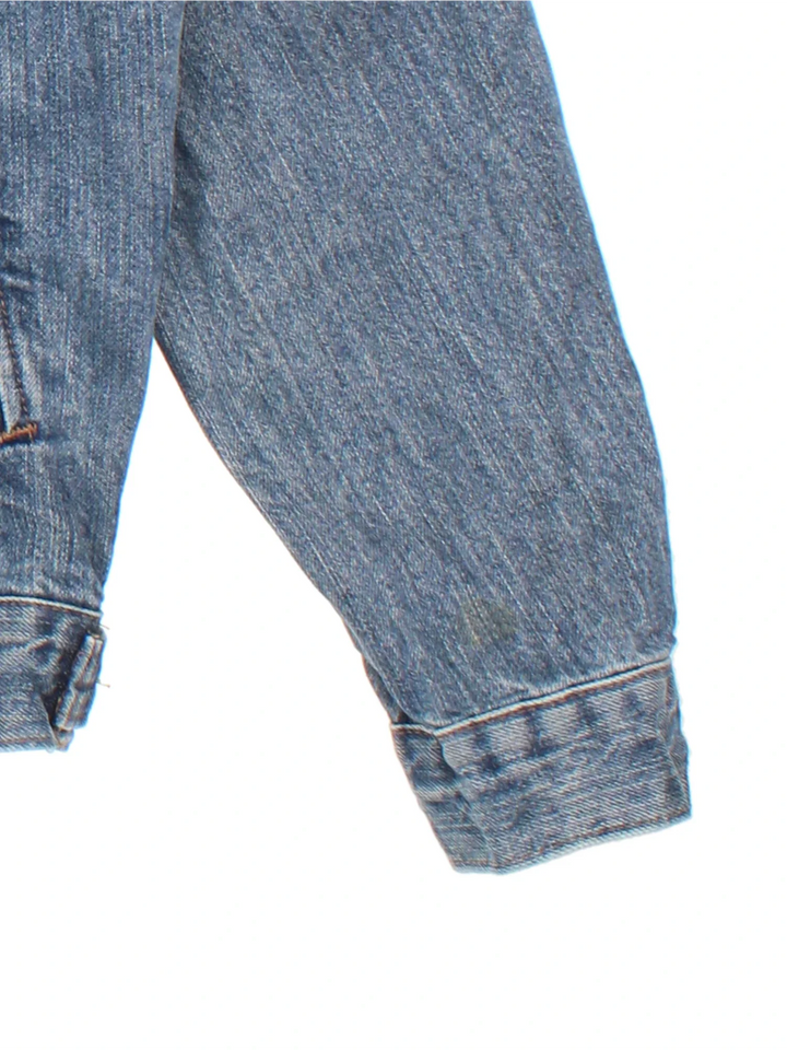 Carhartt Denim Jacket in a blue colourway with button up front, multiple pockets and small classic logo on the front.