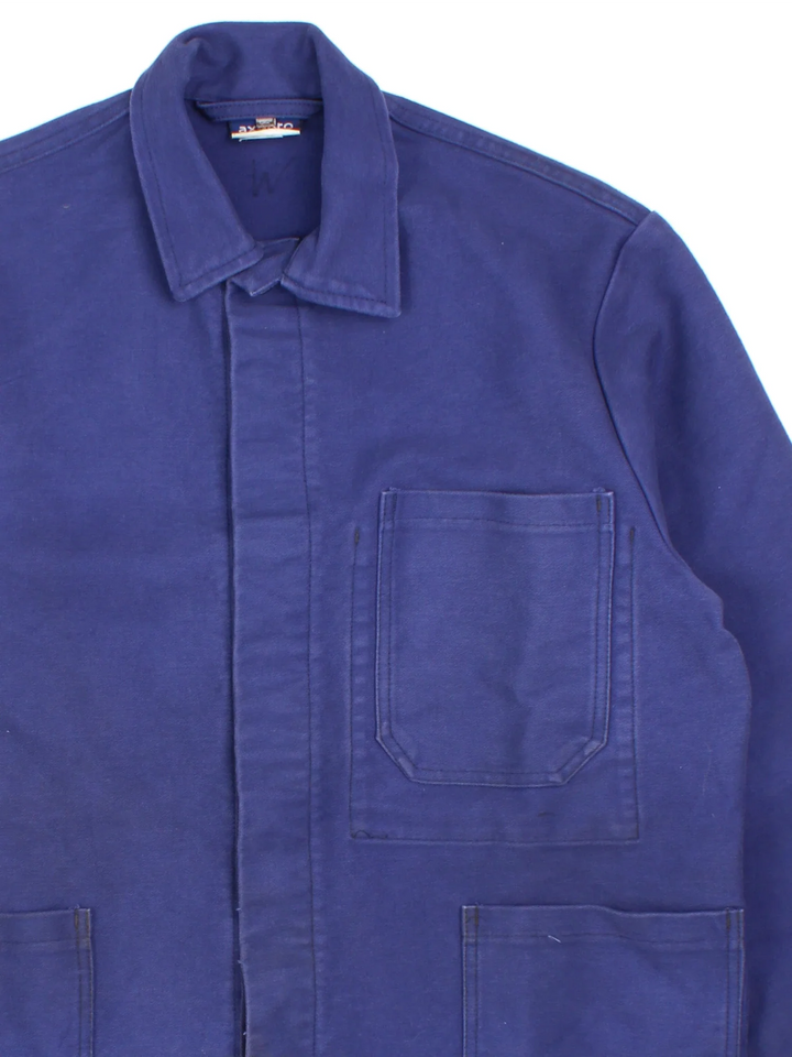 Vintage French Chore Work Jacket in a blue colourway. Buttons up and has multiple pockets.