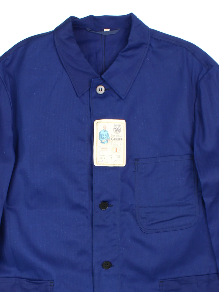 Vintage French Chore Work Jacket in a blue colourway. Buttons up and has multiple pockets.