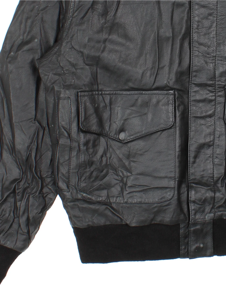 Vintage A-2 Leather Flight Jacket in a black colourway. Zips up and has multiple pockets.
