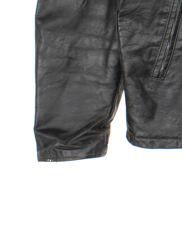 Vintage Leather Biker Jacket in a black colourway. Zips up and has side pockets, and custom Harley Davidson screamin eagle badge patch on the back.
