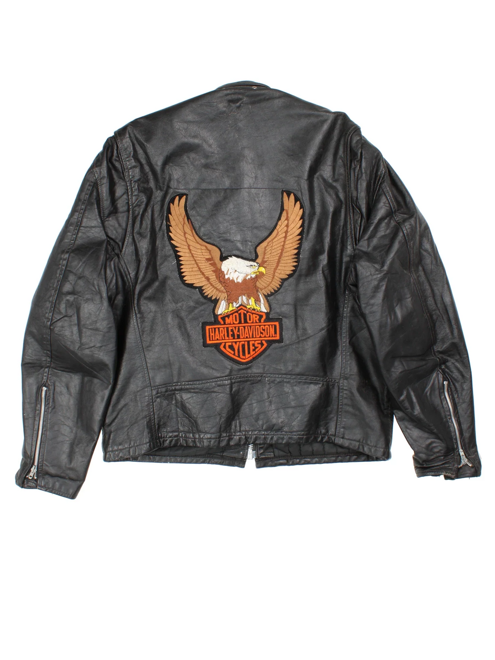 Vintage Leather Biker Jacket in a black colourway. Zips up and has side pockets, and custom Harley Davidson screamin eagle badge patch on the back.