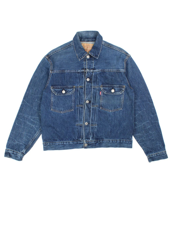 Vintage Levi Strauss 507 Denim Trucker Jacket in a blue colourway. Buttons up and has double chest pockets, and the logo tab embroidered on the front.
