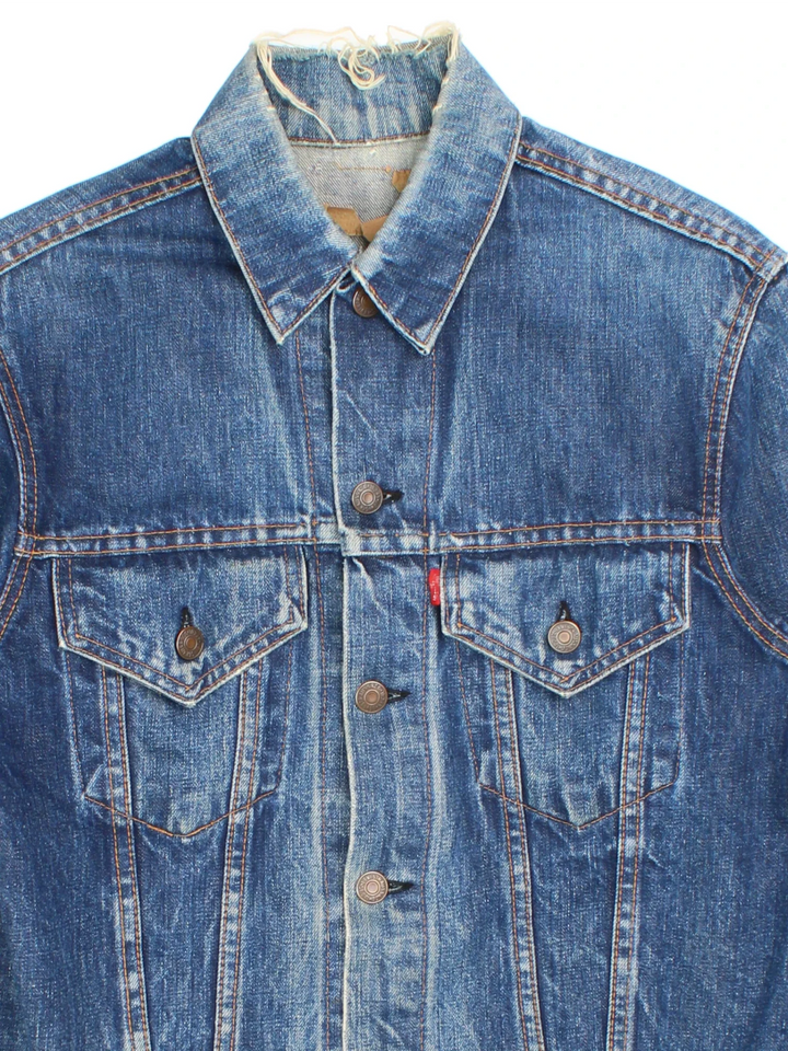 Vintage Levi Strauss Denim Jacket in a blue colourway. Buttons up and has double chest pockets, and the logo tab embroidered on the front.