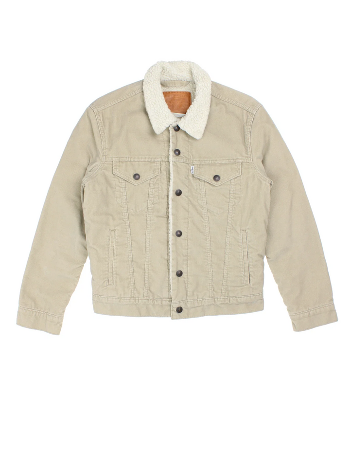 Levi Strauss Sherpa Cord Trucker Jacket in a tan colourway. Buttons up and has multiple pockets, insulated lining, and has the logo tab embroidered on the front.