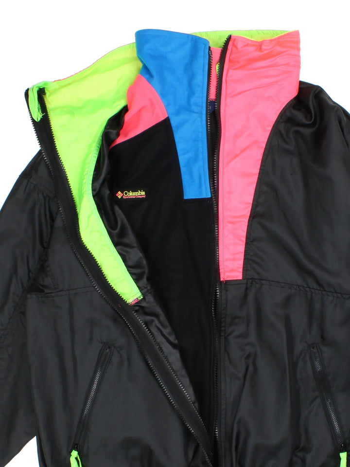 Vintage 90's Columbia Intertrainer 2 in 1 Jacket in a black/pink colourway. Zip fastening, with side pockets, removable track jacket lining and has the logo embroidered on the front.
