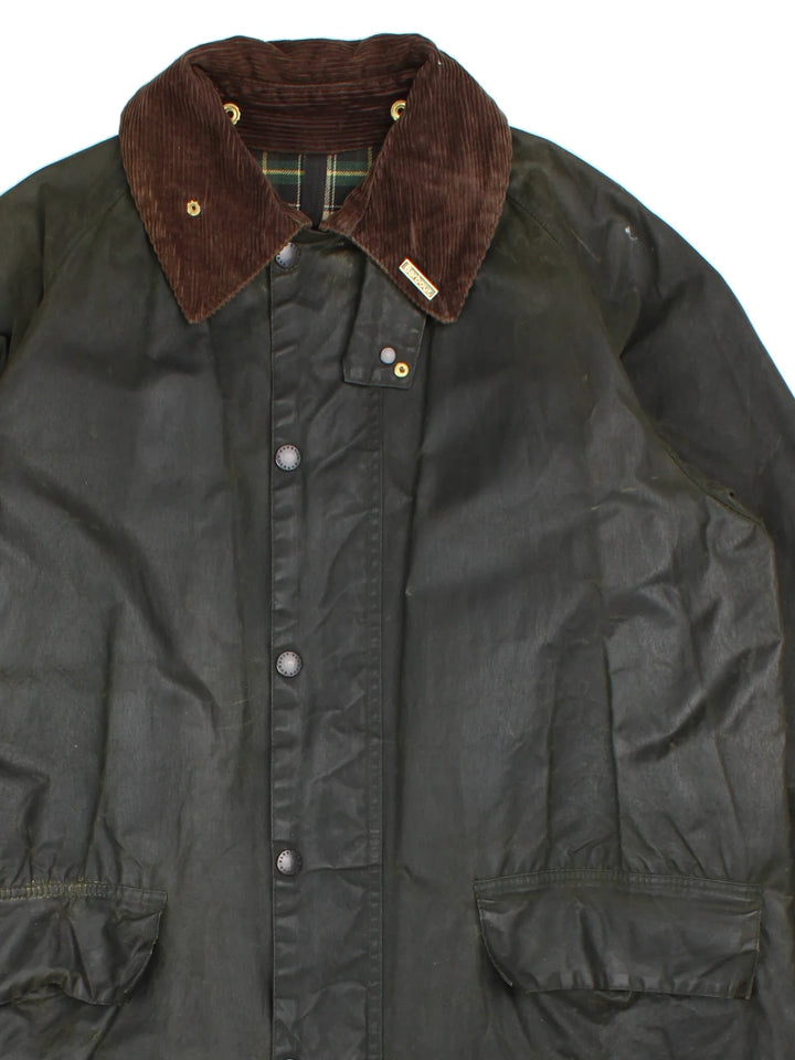 Barbour Burghley Wax Jacket in a green colourway. Zip/button fastening, with multiple pockets, cord collar detail, checked lining and branded badge.